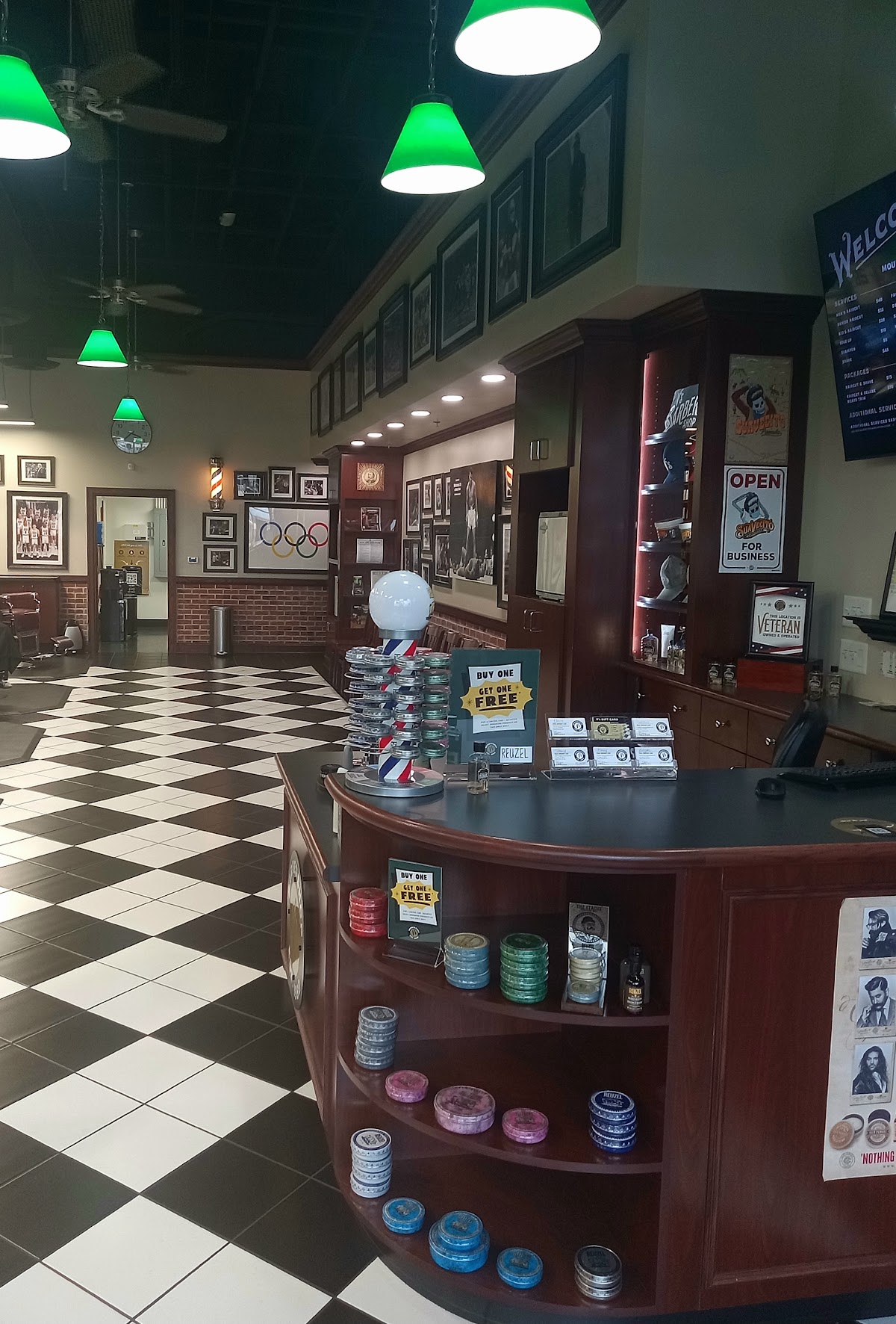 V's Barbershop interior with checkered floor and product display